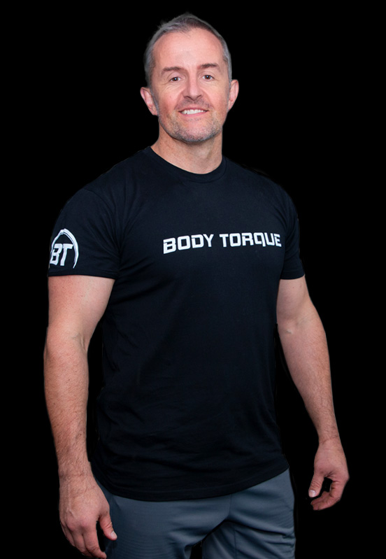 Personal trainer Alex Flint wearing a Body Torque Gym T-shirt, offering one-on-one coaching in Newmarket, Auckland.